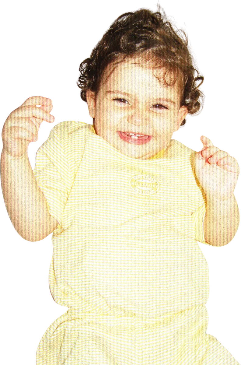 Asma as a baby, laughing with both hands up