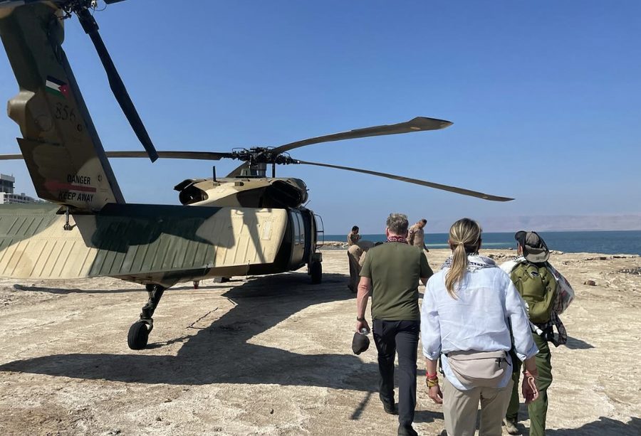 Behind the scenes on Uncharted: Gordon Ramsay and the crew walking to a helicopter by the Dead Sea
